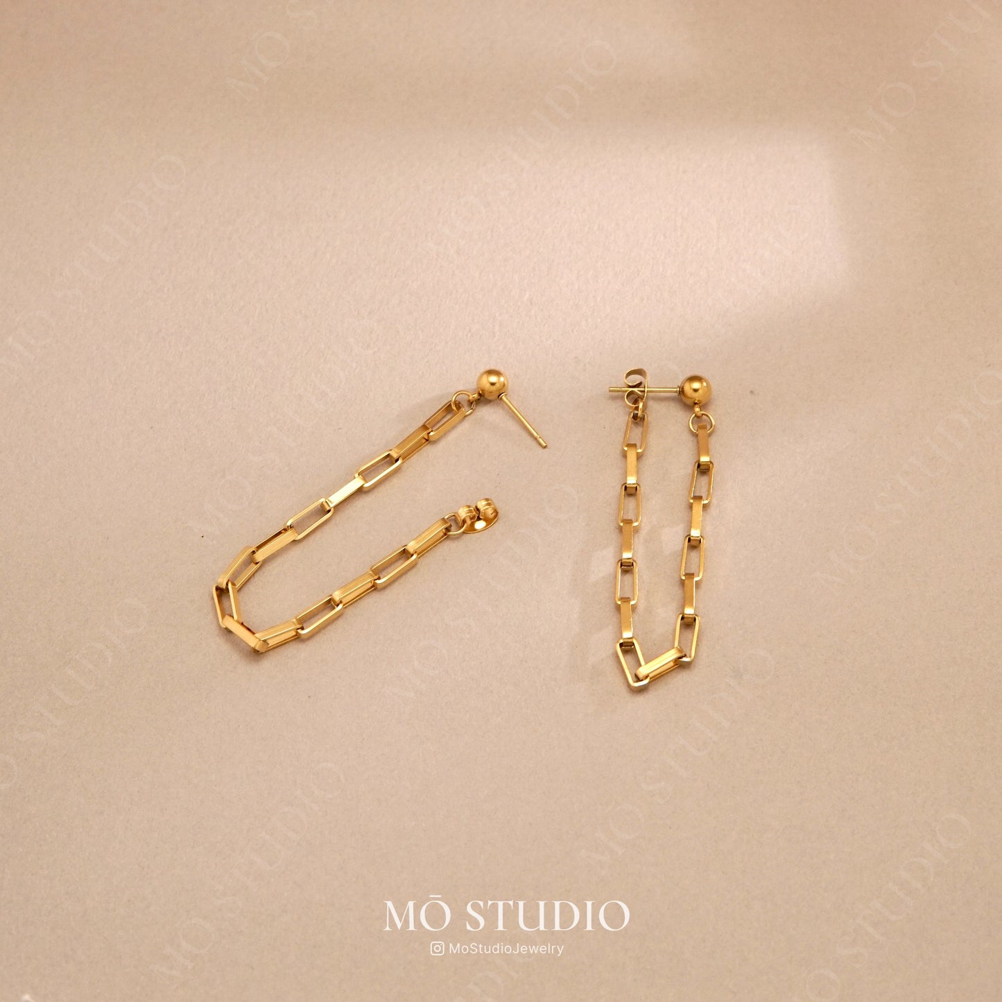 long gold drop stud earrings with linking chain design