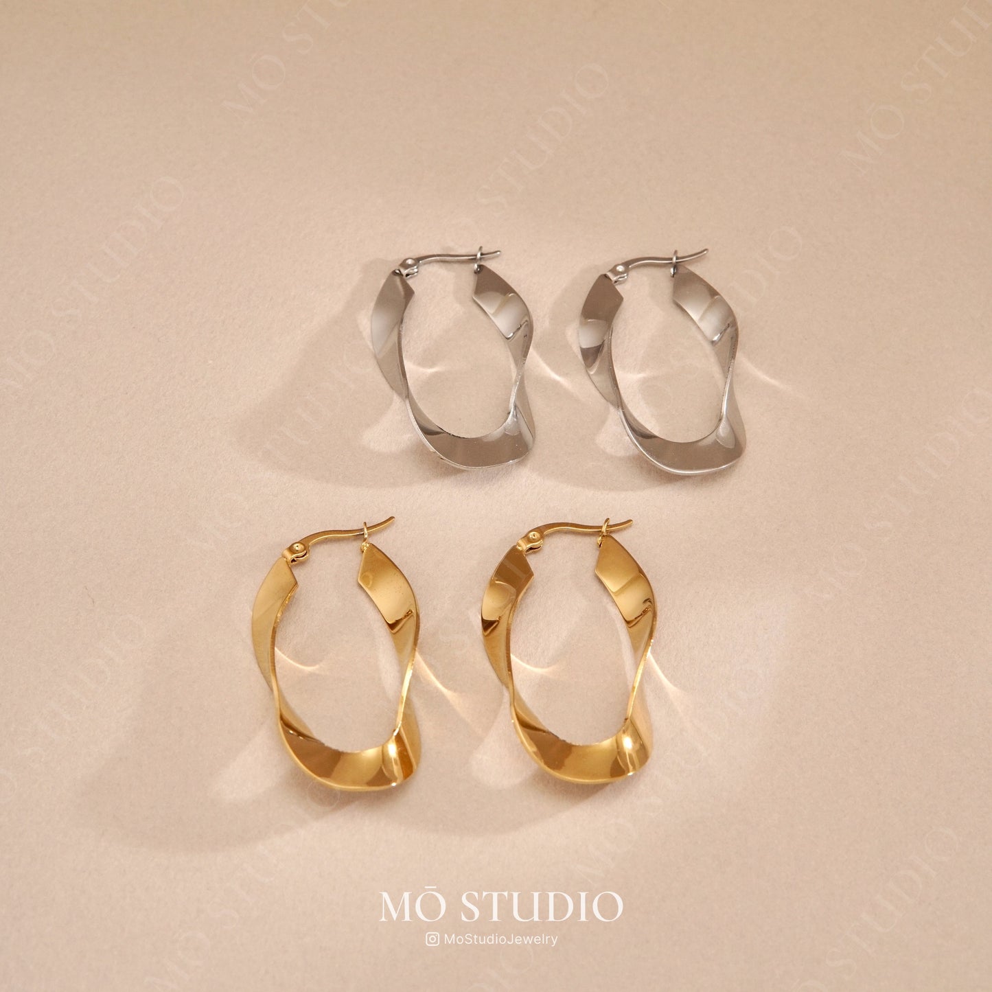chunky gold and silver twisted hoop earrings oversized