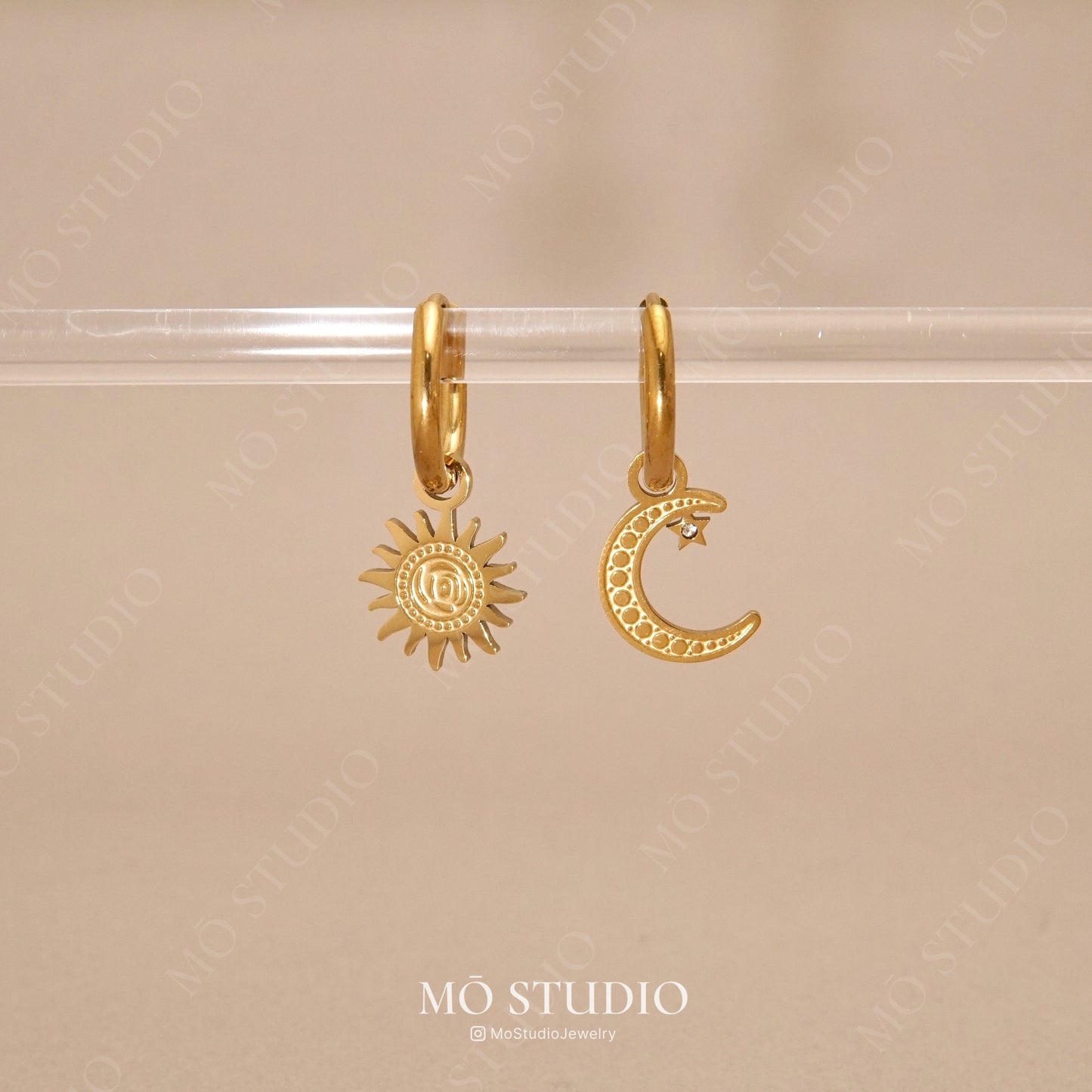 gold mismatched sun and moon hoop earrings