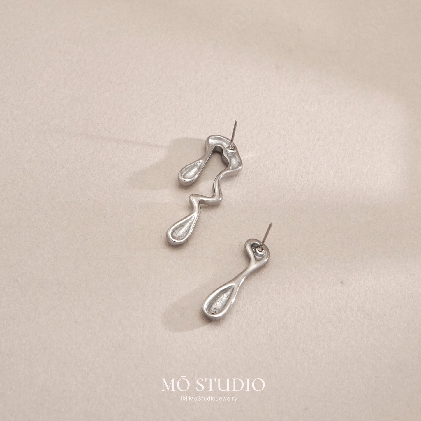Mismatched Teardrop Earrings – Silver Abstract Studs