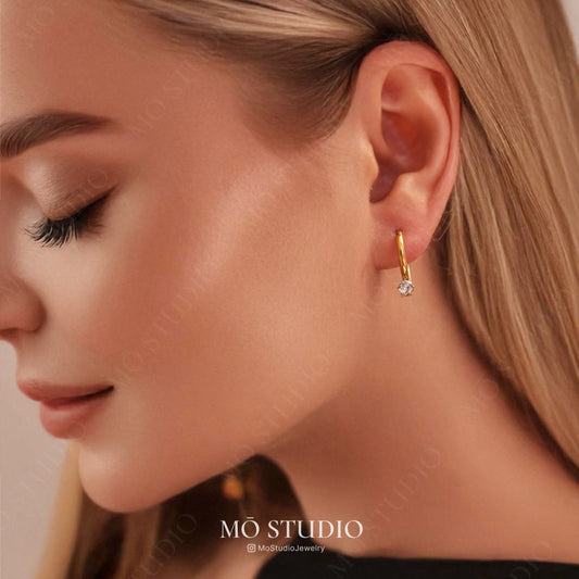 dainty gold huggie hoops with cubic zirconia detail