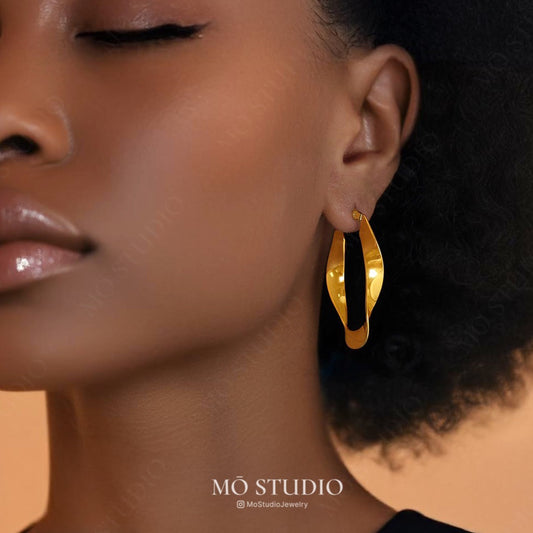 bold vintage-style twisted hoop earrings in gold and silver