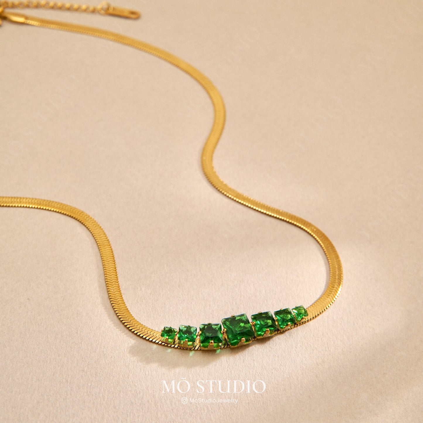 emerald green snake chain necklace with gold finish