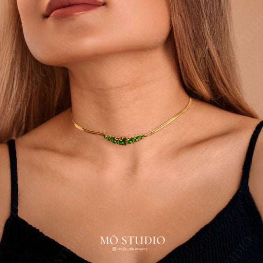 gold herringbone layering necklace with green crystal