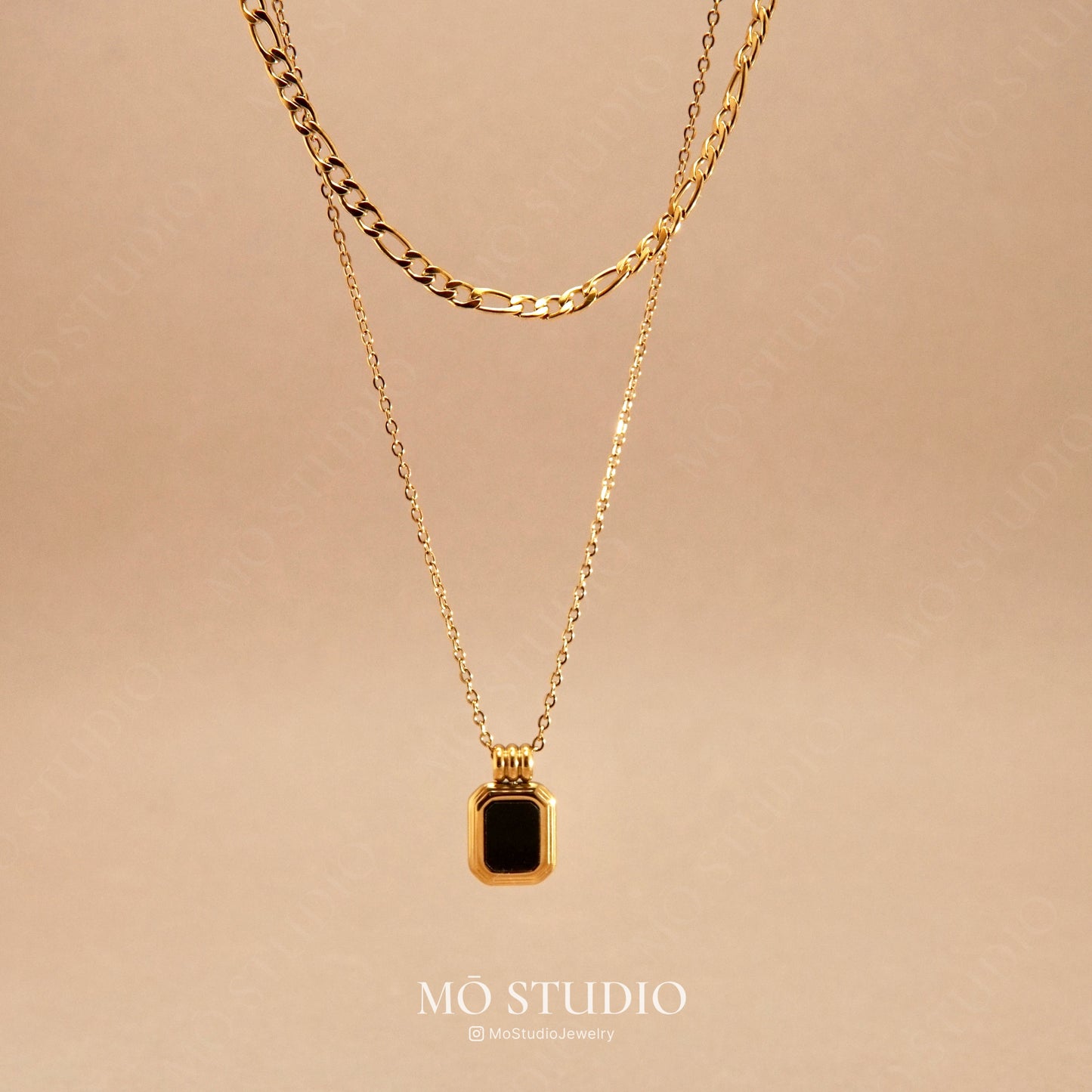 gold layered necklace with black onyx