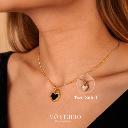 reversible gold heart necklace with black onyx and mother of pearl