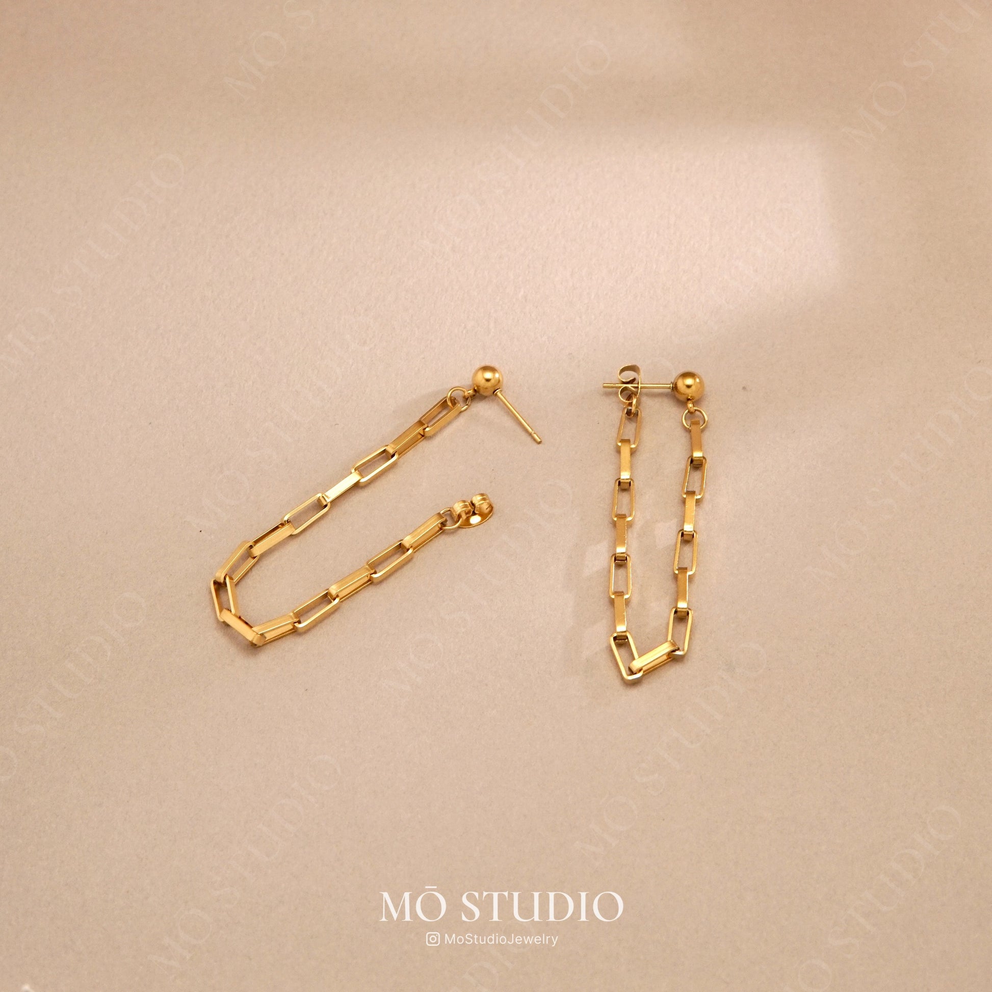 long gold drop stud earrings with linking chain design