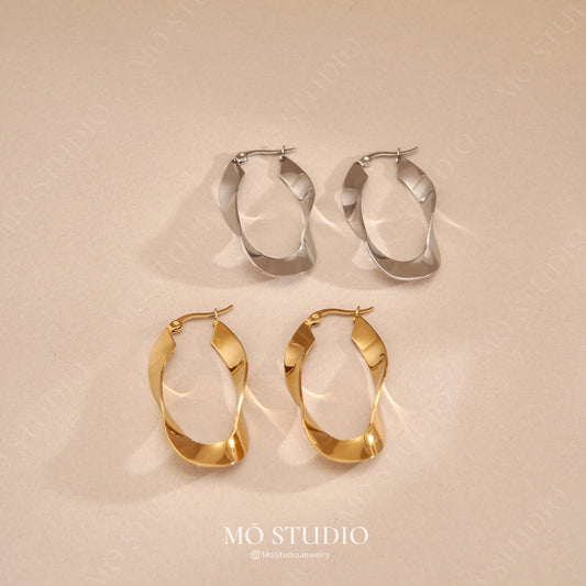 chunky gold and silver twisted hoop earrings oversized