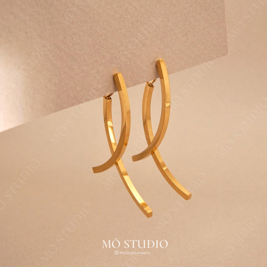 gold spiral tassel drop earrings with double chain design