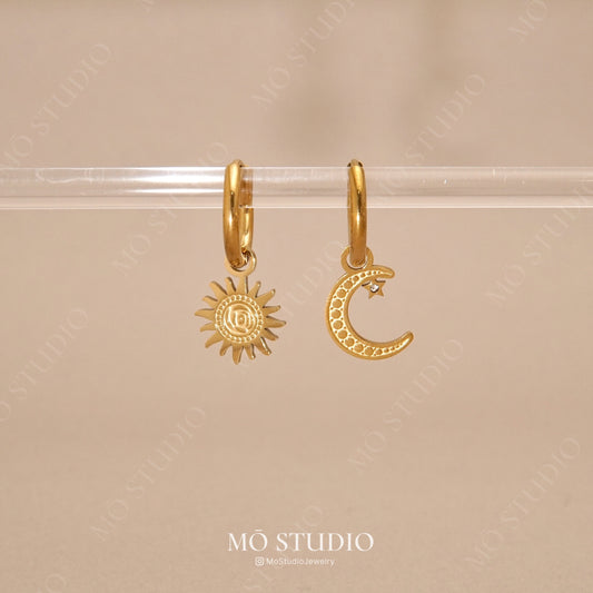 gold mismatched sun and moon hoop earrings