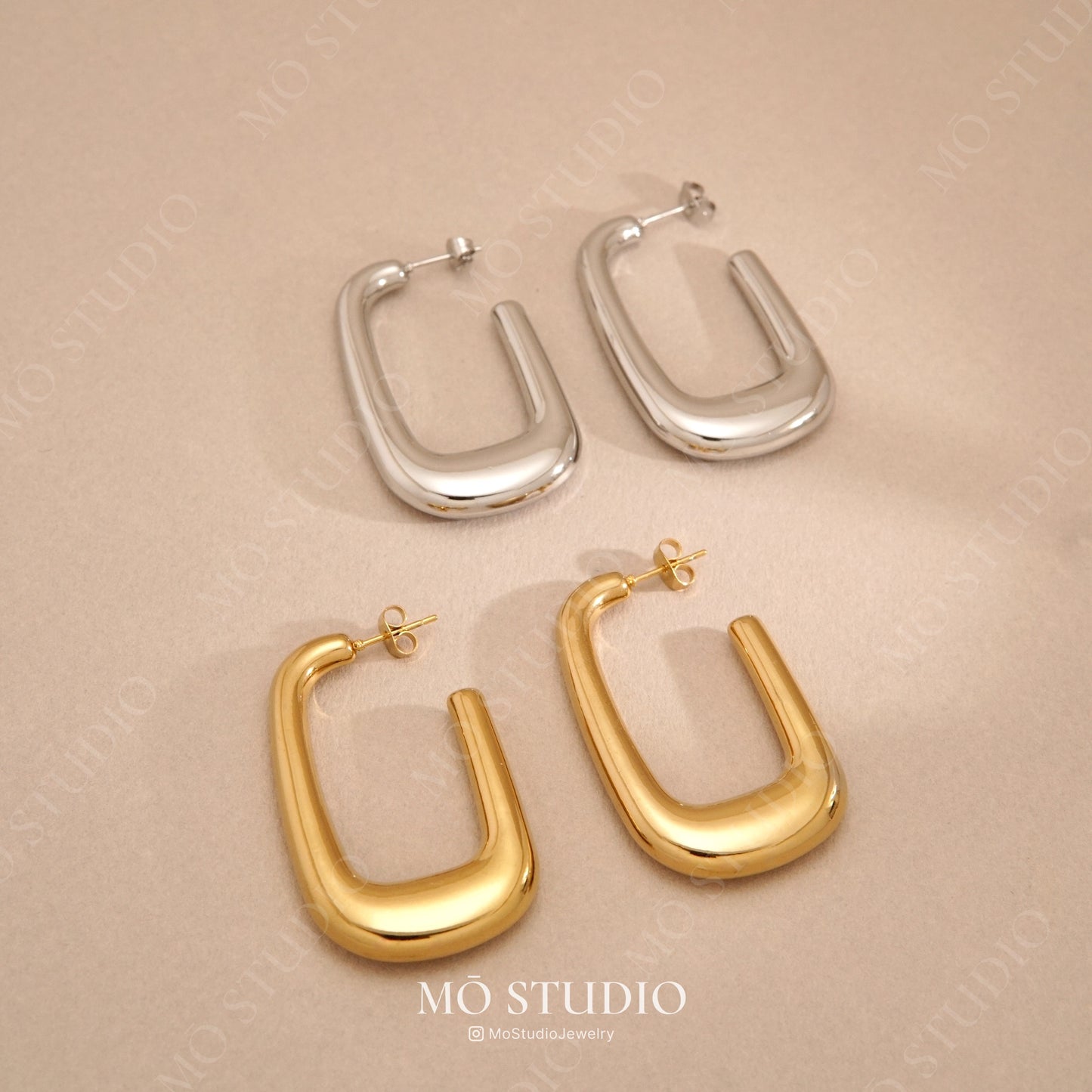 large u-shaped gold and silver hoop earrings statement style