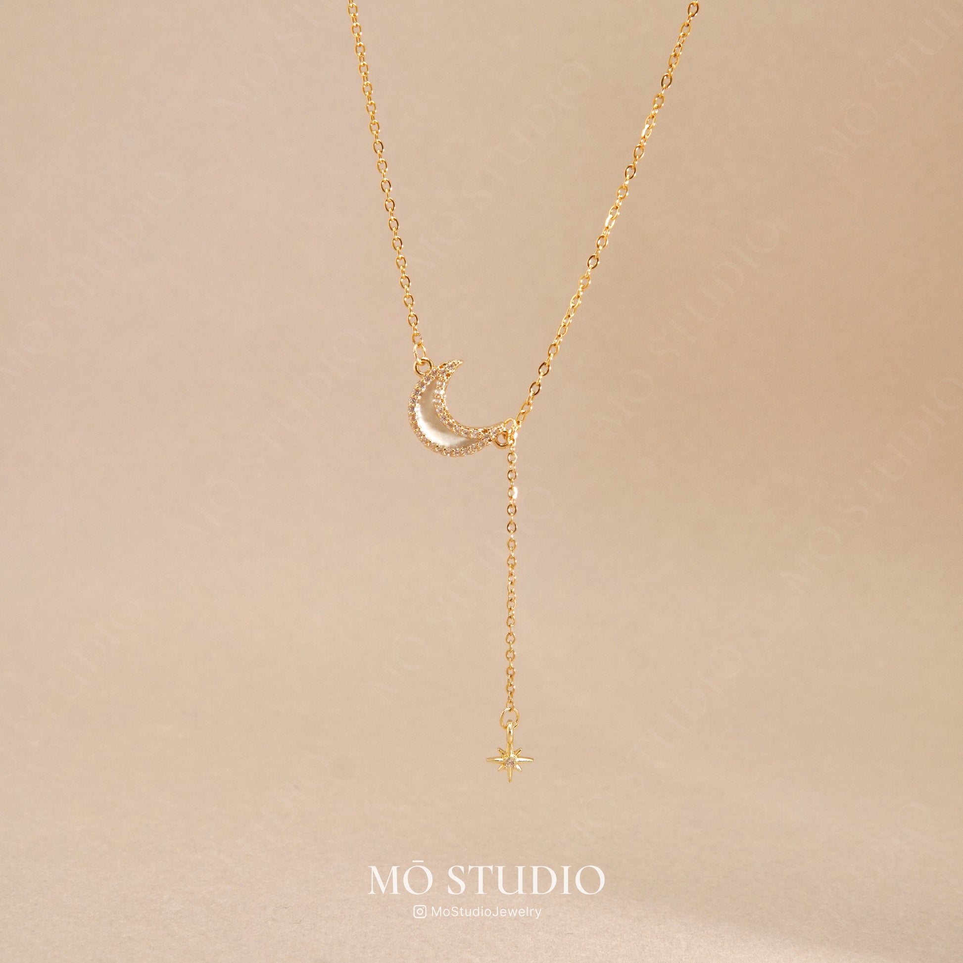 gold moon and star necklace with crystal pendant