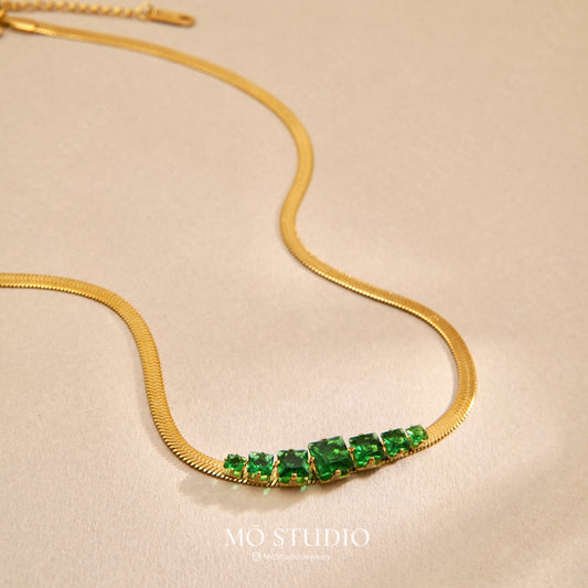 emerald green snake chain necklace with gold finish