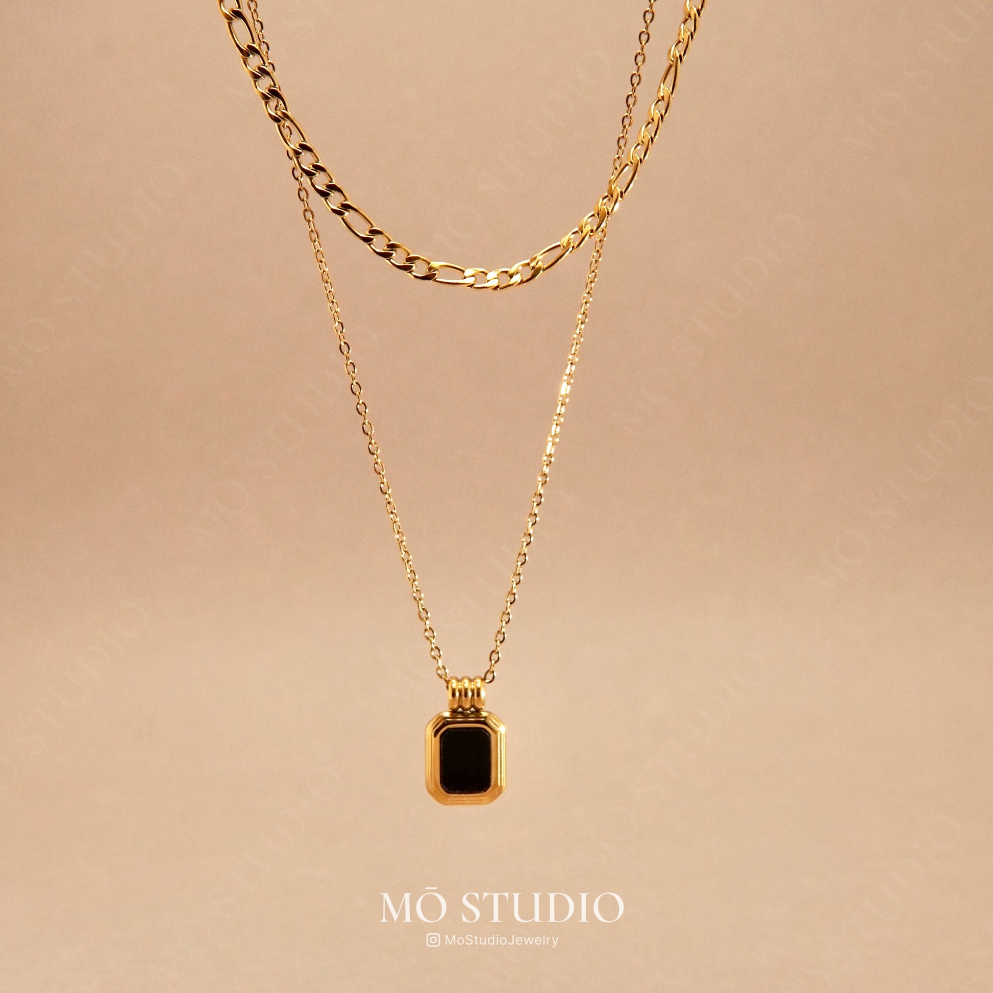 gold layered necklace with black onyx