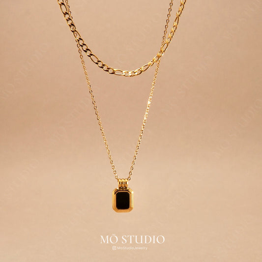 gold layered necklace with black onyx